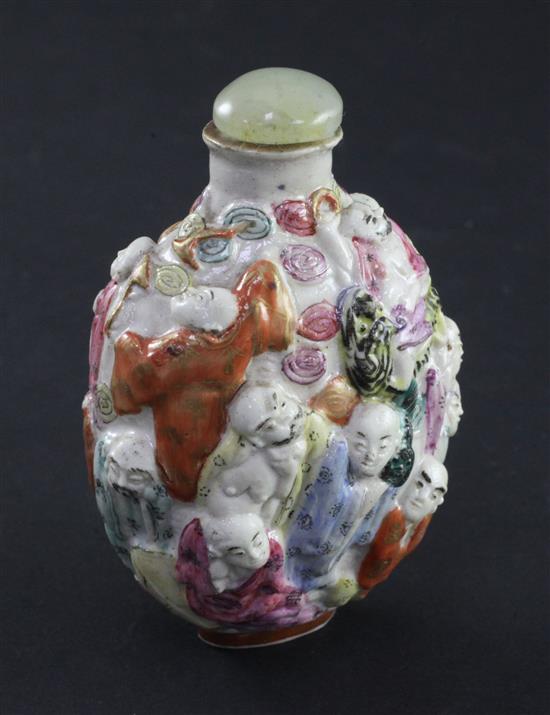 A Chinese moulded famille rose eighteen luohan snuff bottle, Qianlong seal mark, 1820-1850, 7.4cm